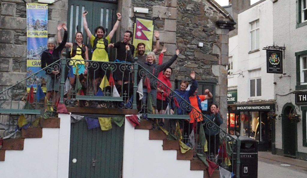 Celebrations by EVMC Wainwright relay team at the end at the Moot Hall in Keswick at 6.30am